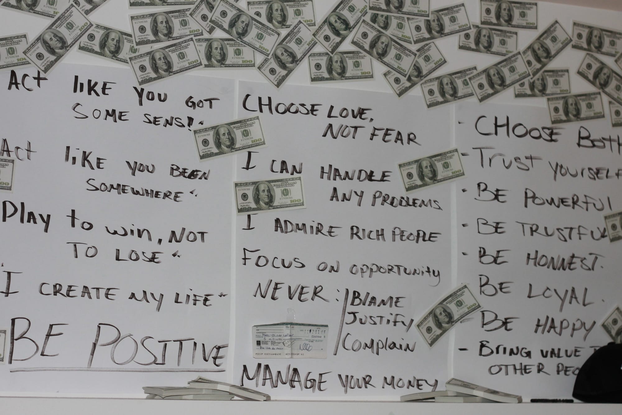 Affirmations Poster on Wall with Money Bills